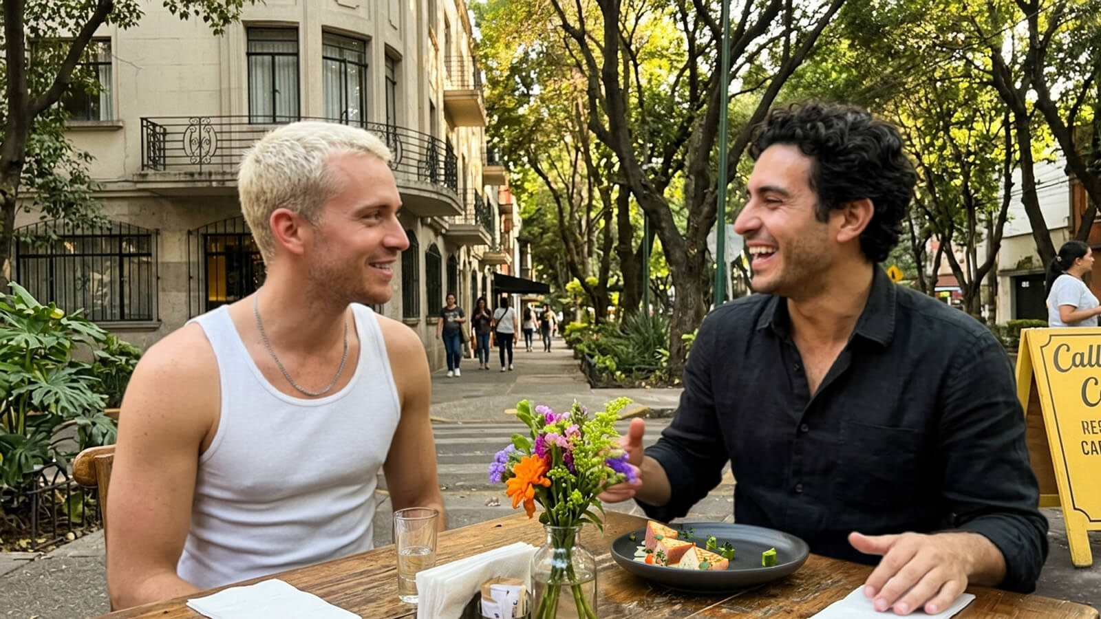 Gay men dining at a restaurant terrace in La Condesa, Mexico City